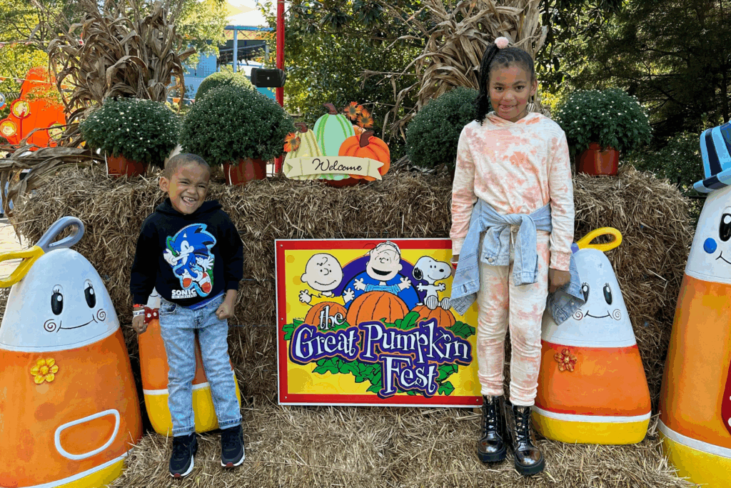 Liv and Jack pose in front of the Great Pumpkin Fest sign at Kings Dominion