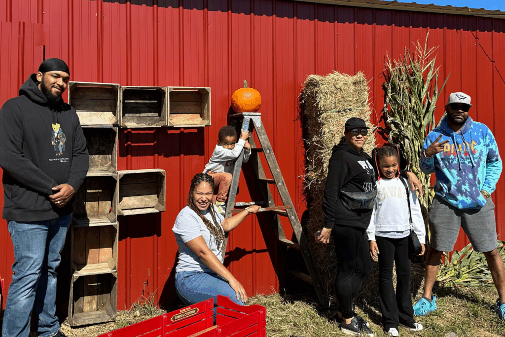 The Acors + Auntie and Uncle at Maryland Corn Maze in front of the Fall wall