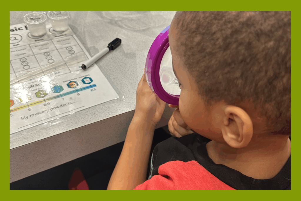 Jack holding a magnifying glass