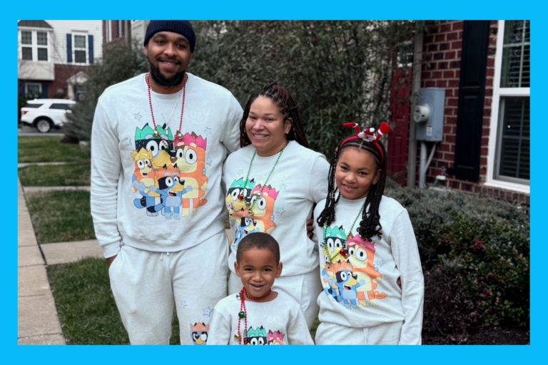 The Acors in Bluey sweatsuits at Christmas time