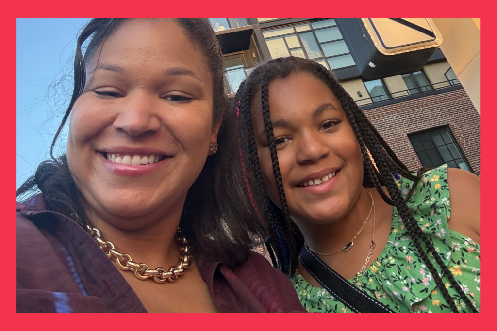 Mom and daughter smile outside of the Hoawrd Theatre in D.C.
