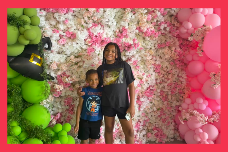 Liv and Jack in front of balloons and flowers at a Wicked Screening