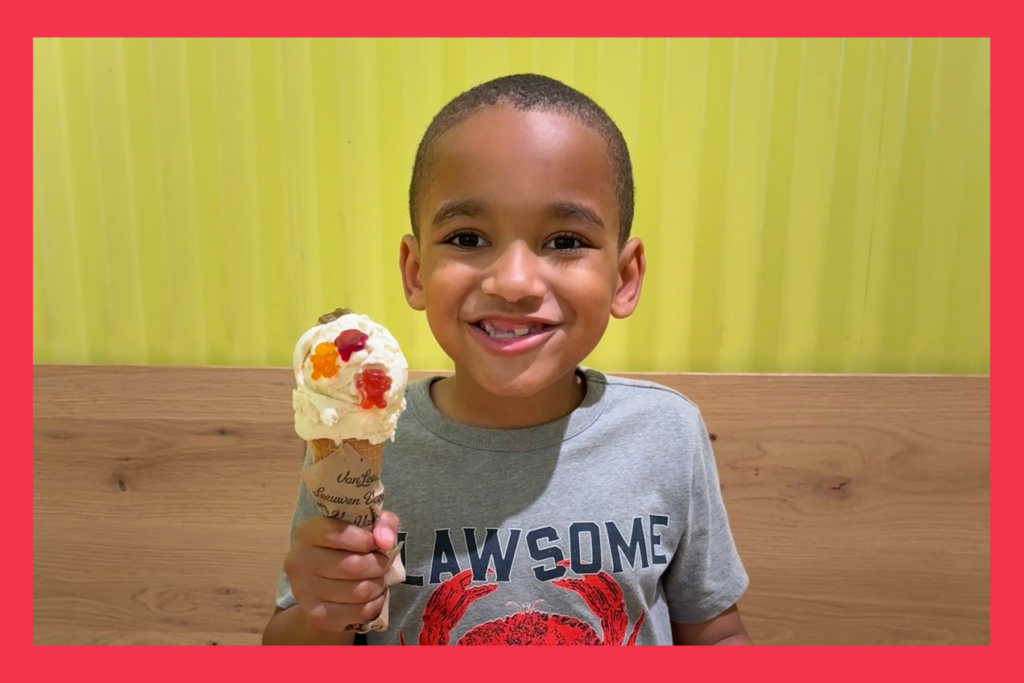 A young boy enjoys an ice cream cone.