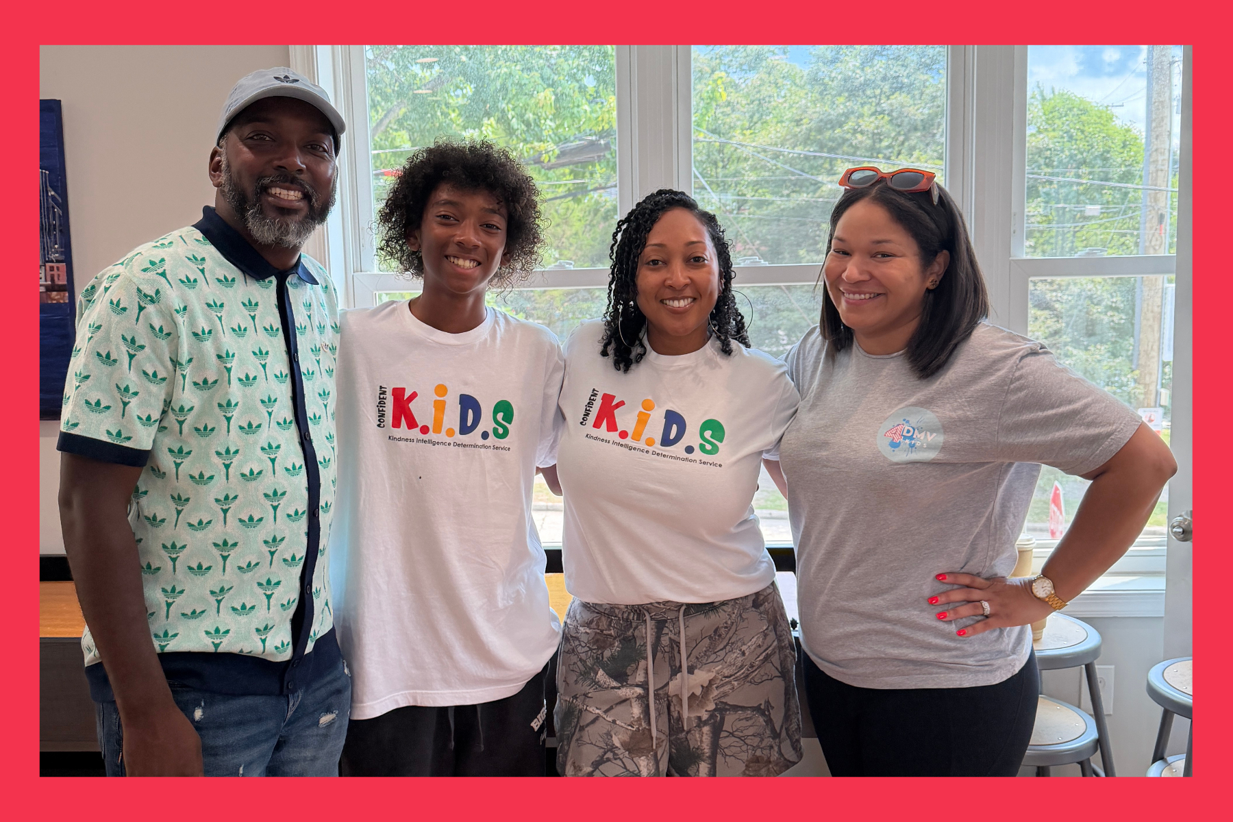 Manny Jennings, author of "It's OK to be me" stands with his parents and Sarah Acors, founder of 4DMV Kids.