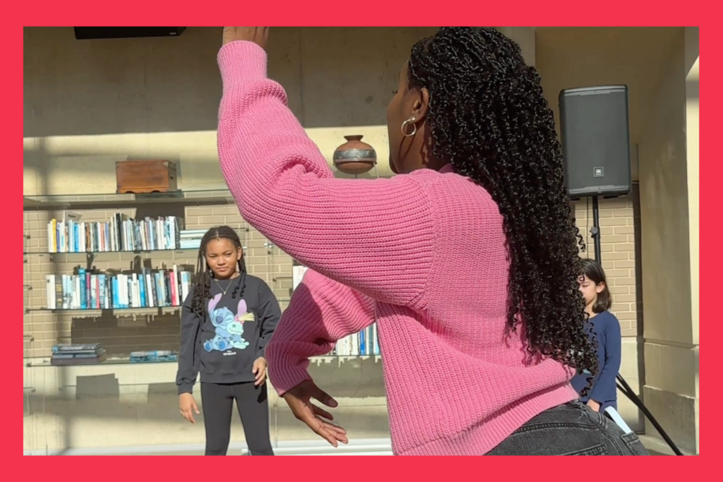 A dance instructor teaches a kids class at arena stage in DC.