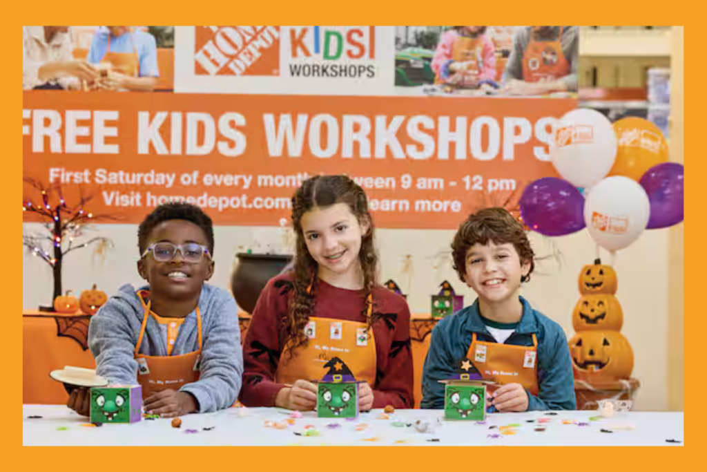 a group of 3 children in Home Depot aprons participate in a free workshop.