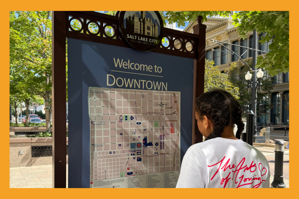 a girl looks at the map of downtown Salt Lake City.