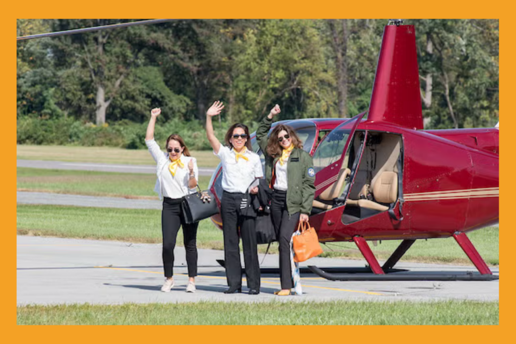 Latina pilots wave outside of their airplane.