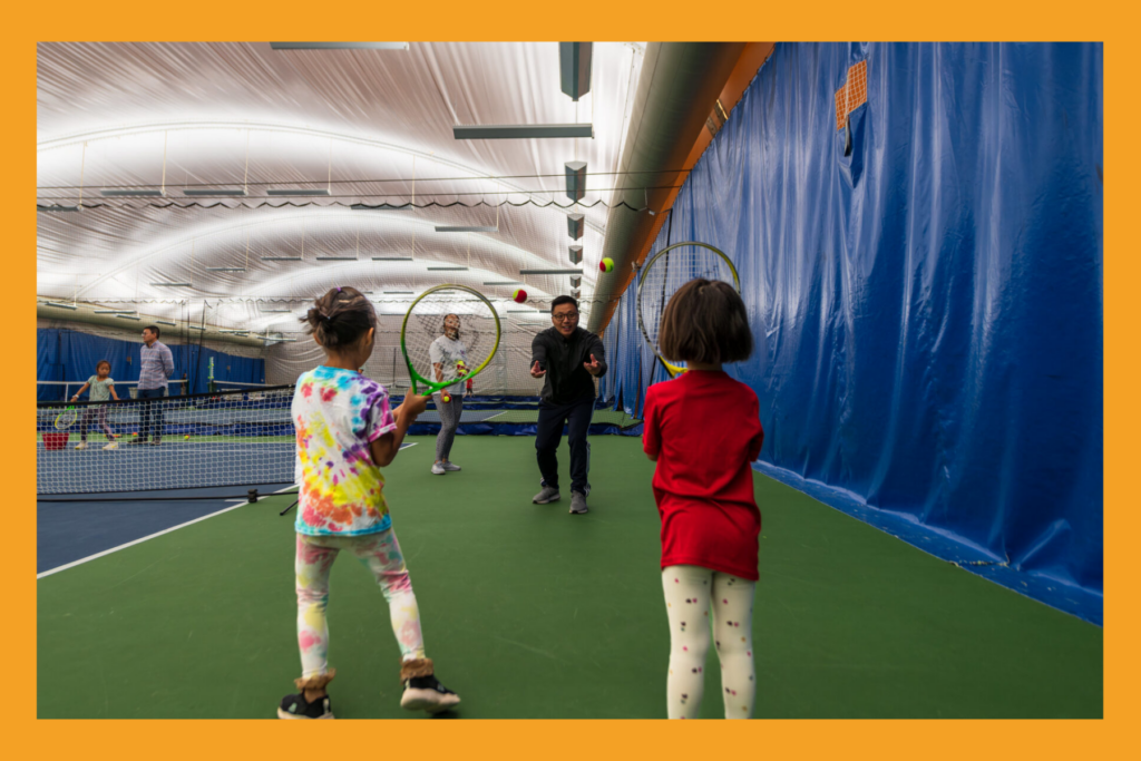 small kids play sports indoors.