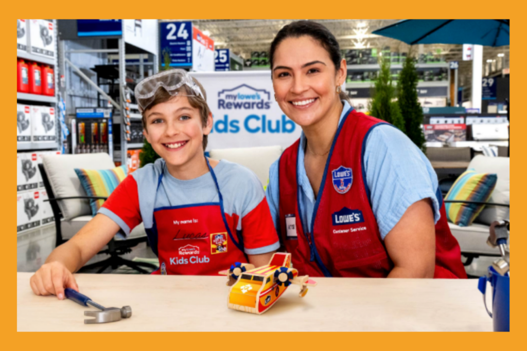 a mom and son in aprons at a free workshop provided by Lowe's Home Improvement.